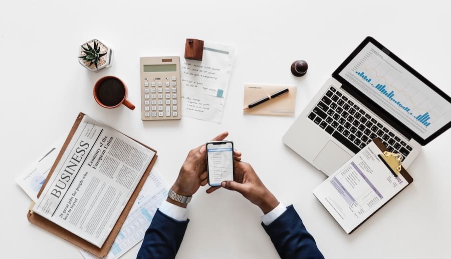 A business owner and their desk workspace